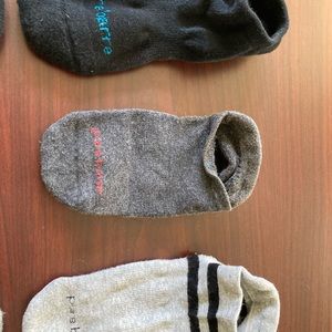 Three (3) pairs of Pure Barre grip socks.